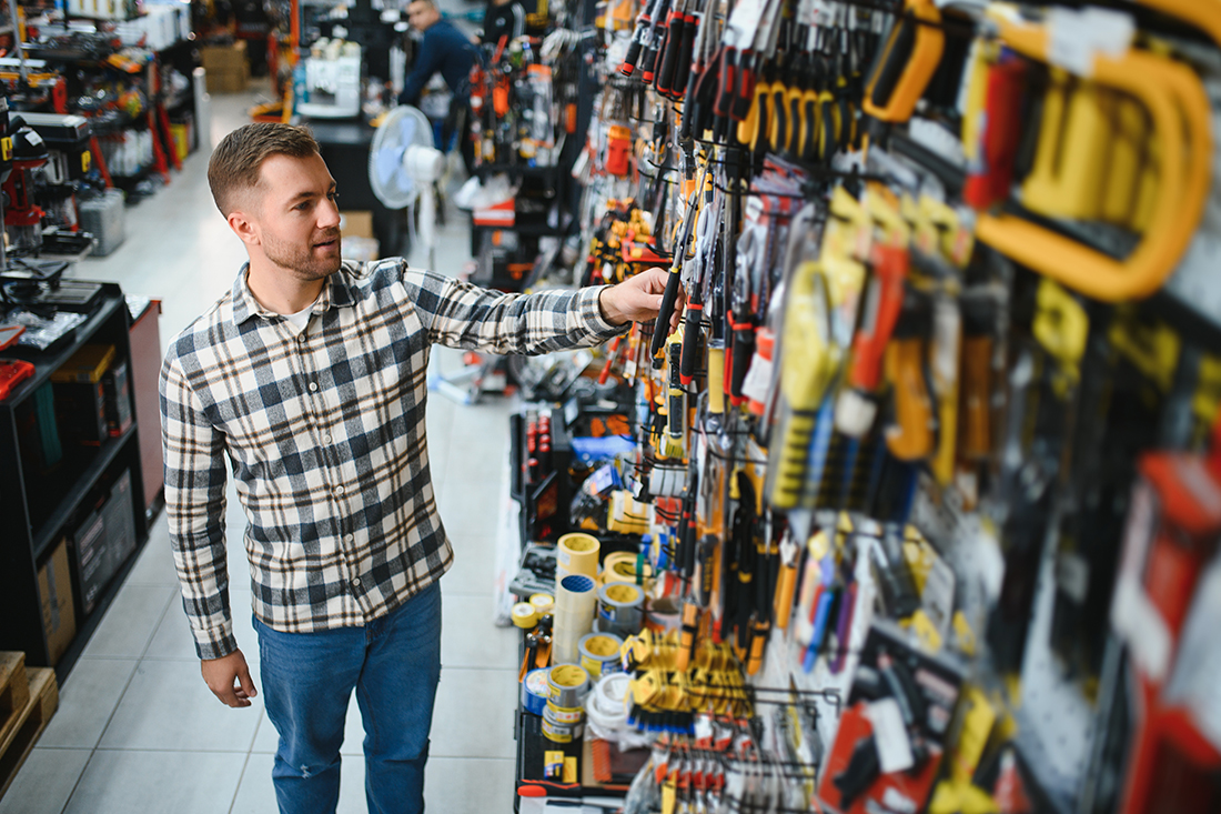 Customer selecting tools in a hardware shop